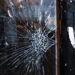 Broken Glass on Wooden Surface